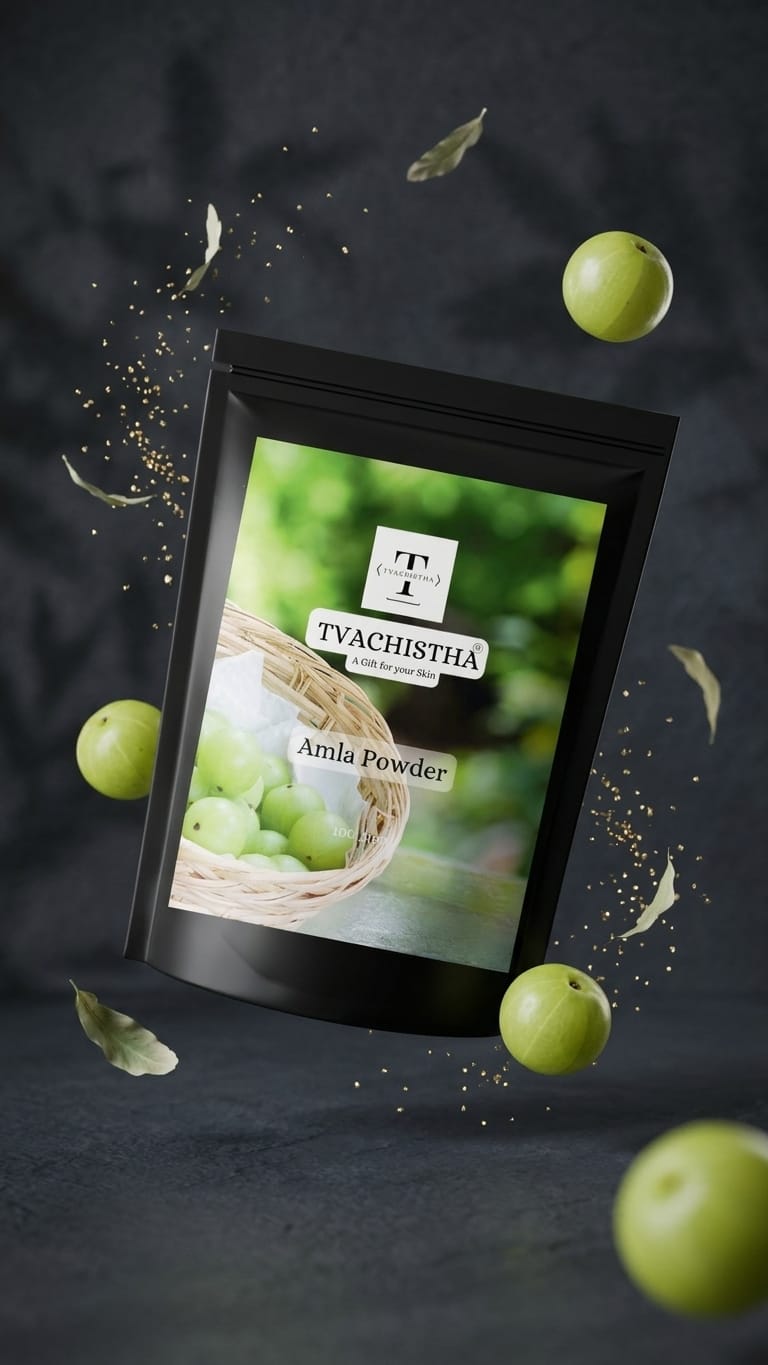 A premium black pouch of Tvachistha Pure Amla Powder showcasing its Vitamin-C dense consistency for hair density and skin glow.