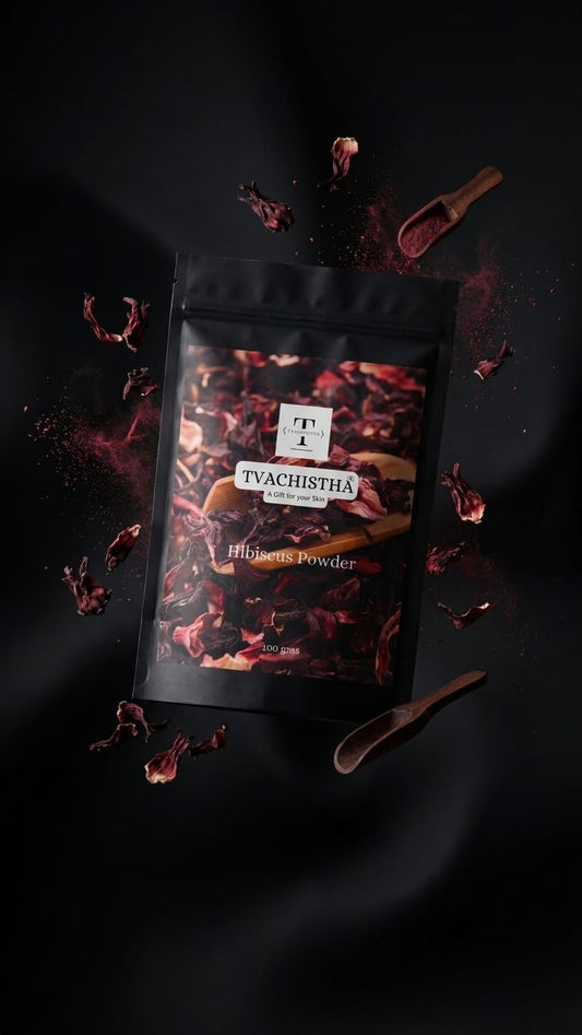 A premium black pouch of Tvachistha Pure Hibiscus Powder displaying its fine botanical texture for dual-action skin firming and hair conditioning.
