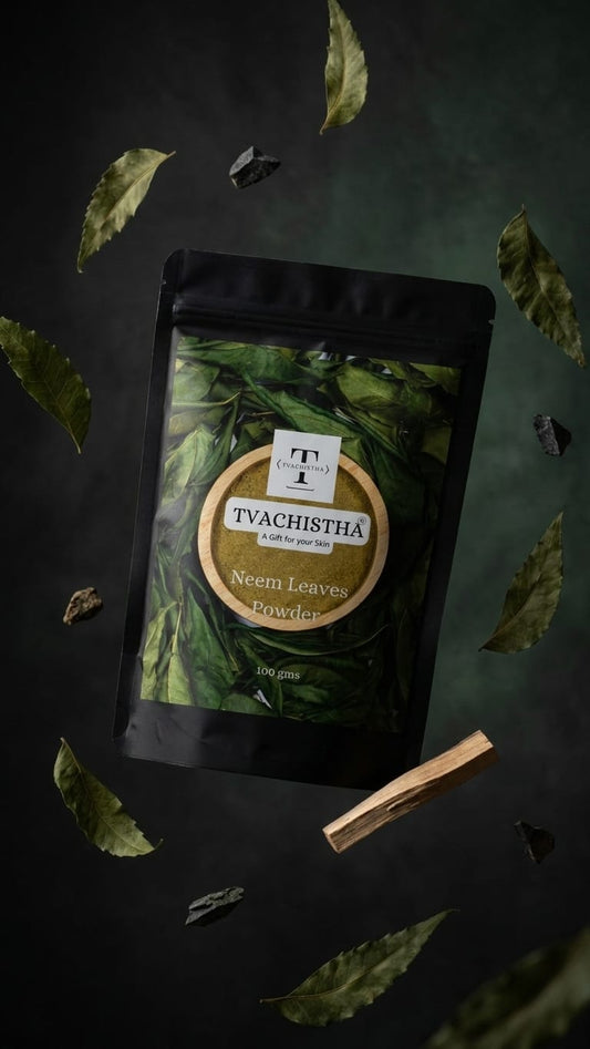 A premium black pouch of Tvachistha Neem Leaves Powder displaying its pure antibacterial texture for acne and dandruff care.