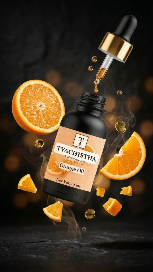 A black glass dropper bottle of Tvachistha Orange Essential Oil for brightening dark spots and boosting a mirror hair shine.