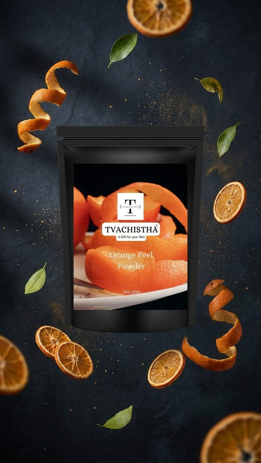 A premium black pouch of Tvachistha Orange Peel Powder showcasing its bright, fine botanical texture.